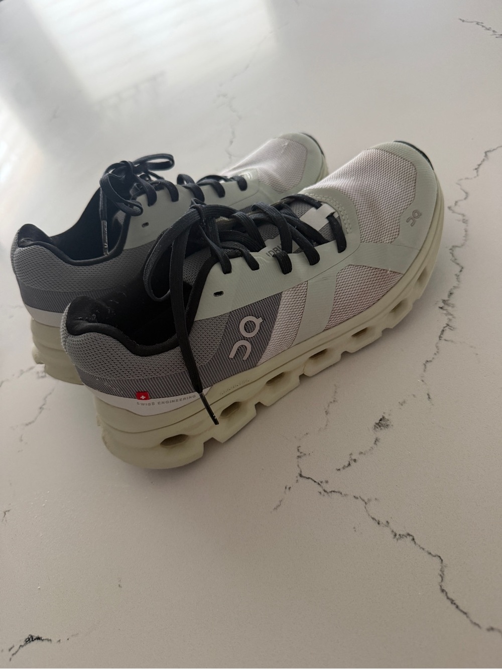 On Running Cloud Sneakers in Light Gray and Black ladies 7